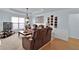 Spacious living room with a tray ceiling, neutral walls, and comfortable seating at 1885 Hickory Station Cir, Snellville, GA 30078