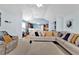 Bright living area showcasing a large sectional sofa, neutral decor, and open-concept design at 1885 Hickory Station Cir, Snellville, GA 30078