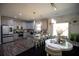 Modern kitchen features stainless appliances, gray cabinets, kitchen island and breakfast bar seating at 5663 Eternal Dr, Atlanta, GA 30349