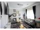 Inviting living room featuring plush gray sofas, stylish decor, and large window, filled with natural light at 5663 Eternal Dr, Atlanta, GA 30349
