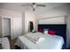 Comfortable main bedroom features a plush blue headboard, neutral decor, and ample natural light at 5663 Eternal Dr, Atlanta, GA 30349