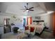 Bright main bedroom featuring a tray ceiling, comfy sitting area, and elegant decorations at 5663 Eternal Dr, Atlanta, GA 30349