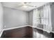 Empty bedroom with white molding, gray walls and hardwood floors at 609 Ashton Manor Dr, Loganville, GA 30052