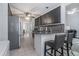 Open kitchen layout with breakfast bar and stainless steel appliances at 609 Ashton Manor Dr, Loganville, GA 30052