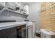Laundry room equipped with modern white washer and dryer at 609 Ashton Manor Dr, Loganville, GA 30052