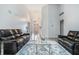 Bright living room with vaulted ceilings, hardwood floors, and decorative fireplace at 609 Ashton Manor Dr, Loganville, GA 30052