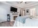 Main bedroom showing a fireplace with built-ins and a ceiling fan at 609 Ashton Manor Dr, Loganville, GA 30052