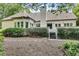 View of the lush backyard, stairs leading to a deck, and landscaped hedges at 1285 Rivershyre Pkwy, Lawrenceville, GA 30043