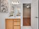 Bathroom featuring a single vanity, framed mirror, and tile flooring at 1285 Rivershyre Pkwy, Lawrenceville, GA 30043