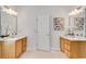 Bathroom showcasing dual vanities, framed mirrors, and tile flooring at 1285 Rivershyre Pkwy, Lawrenceville, GA 30043