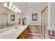 Stylish bathroom featuring unique design elements, ample counter space, and a shower with glass doors at 1285 Rivershyre Pkwy, Lawrenceville, GA 30043