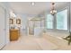 Bright bathroom showcasing a glass shower, soaking tub, and a beautiful light fixture at 1285 Rivershyre Pkwy, Lawrenceville, GA 30043