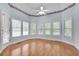 Spacious bedroom with hardwood floors, large windows and a ceiling fan at 1285 Rivershyre Pkwy, Lawrenceville, GA 30043