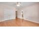 Bedroom featuring hardwood floors, a ceiling fan, and a spacious closet at 1285 Rivershyre Pkwy, Lawrenceville, GA 30043