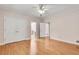 Bright bedroom features hardwood floors, a ceiling fan, and a large closet for ample storage at 1285 Rivershyre Pkwy, Lawrenceville, GA 30043
