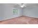 Bedroom featuring carpet flooring and a window, providing natural light and a cozy ambiance at 1285 Rivershyre Pkwy, Lawrenceville, GA 30043