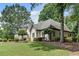 Side view of a well-maintained house with lush landscaping and mature trees surrounding the property at 1285 Rivershyre Pkwy, Lawrenceville, GA 30043