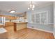 Well-lit kitchen and dining area with hardwood floors and large windows at 1285 Rivershyre Pkwy, Lawrenceville, GA 30043