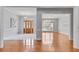 Spacious open-concept living area with hardwood floors, elegant chandeliers, and abundant natural light at 1285 Rivershyre Pkwy, Lawrenceville, GA 30043
