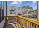 View from the back porch overlooking townhome rear garages and an upper level porch at 2034 Rockledge Ne Rd, Atlanta, GA 30324