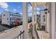 View from the balcony highlighting the neighborhood street with sidewalks and well-maintained townhomes at 2034 Rockledge Ne Rd, Atlanta, GA 30324