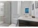 Bathroom featuring a walk-in shower, vanity, and a view into the adjacent bedroom at 2034 Rockledge Ne Rd, Atlanta, GA 30324