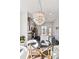 Dining room features a modern light fixture and connects to a kitchen with granite countertops at 2034 Rockledge Ne Rd, Atlanta, GA 30324