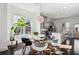 Dining area boasts a modern chandelier, views of the outdoors, and access to the kitchen at 2034 Rockledge Ne Rd, Atlanta, GA 30324
