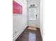 Welcoming entryway showcasing wood floors and a bright white door at 2034 Rockledge Ne Rd, Atlanta, GA 30324