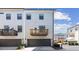 Rear exterior of a townhome featuring a garage and upper level porch at 2034 Rockledge Ne Rd, Atlanta, GA 30324