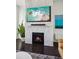 Modern fireplace featuring decorative tile and an flatscreen television at 2034 Rockledge Ne Rd, Atlanta, GA 30324