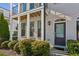Charming townhome exterior featuring an arched front door with the house number 2034 at 2034 Rockledge Ne Rd, Atlanta, GA 30324