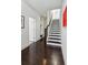 Hallway featuring a staircase, beautiful flooring, and artistic wall decor at 2034 Rockledge Ne Rd, Atlanta, GA 30324