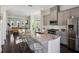 Bright, open kitchen with stainless steel appliances, a large granite island, and bar stool seating at 2034 Rockledge Ne Rd, Atlanta, GA 30324