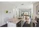 An expansive kitchen with stainless steel appliances, a sprawling granite island with a view into the living room at 2034 Rockledge Ne Rd, Atlanta, GA 30324