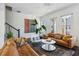 Spacious living room with hardwood floors, and comfortable leather sofas at 2034 Rockledge Ne Rd, Atlanta, GA 30324