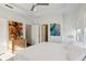 Bright main bedroom features a ceiling fan, neutral walls, and access to the ensuite bathroom at 2034 Rockledge Ne Rd, Atlanta, GA 30324