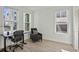 Well-lit office with multiple windows, a comfortable chair, and a modern desk for a productive workspace at 2034 Rockledge Ne Rd, Atlanta, GA 30324