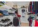 Organized walk-in closet with shelving and hanging rods, maximizing storage space for clothing and accessories at 2034 Rockledge Ne Rd, Atlanta, GA 30324