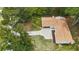 Aerial view of home on landscaped lot shows driveway and proximity to lush greenery at 4376 Riverwood Cir, Decatur, GA 30035