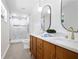 Modern bathroom with double sinks, granite countertop, walk-in shower, and tile flooring at 4376 Riverwood Cir, Decatur, GA 30035
