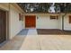 Beautiful entryway with double wood doors and white brick and dark brown trim at 4376 Riverwood Cir, Decatur, GA 30035