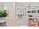 Bright and airy living room with floor to ceiling windows and an open floor plan to the dining and kitchen at 4376 Riverwood Cir, Decatur, GA 30035