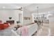 Bright, open-concept living space with hardwood floors connecting the living, dining, and kitchen areas at 4376 Riverwood Cir, Decatur, GA 30035
