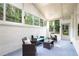 Enclosed patio with brick walls, skylights, and ample seating for relaxing and entertaining at 4376 Riverwood Cir, Decatur, GA 30035