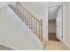 Interior staircase with wood and metal railings, leading to the lower level of the home at 4376 Riverwood Cir, Decatur, GA 30035