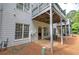 Exterior of home showing backyard with patio, multiple windows, and upper deck with covered porch at 5492 Glenridge Dr # 536, Atlanta, GA 30342
