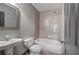 Cozy bathroom with tub/shower combo and pedestal sink at 5492 Glenridge Dr # 536, Atlanta, GA 30342