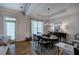 Elegant dining room featuring crown molding, natural light, and a stylish chandelier at 5492 Glenridge Dr # 536, Atlanta, GA 30342