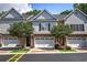 Charming townhome with brick facade, manicured landscaping, and attached garages at 5492 Glenridge Dr # 536, Atlanta, GA 30342